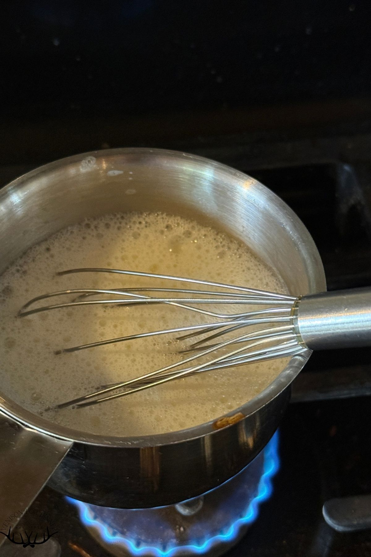 Whisk in frothed milk.
